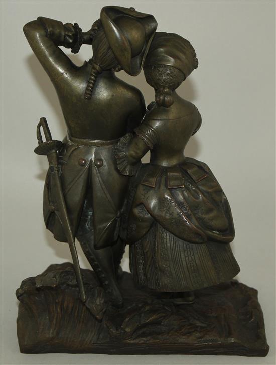 A late 19th century patinated figural bronze modelled as a soldier and his wife, 9.75ins high